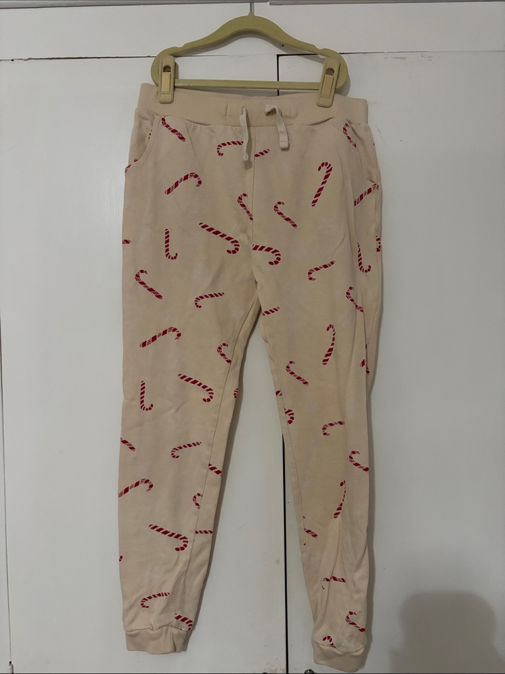 Dot Dot Smile Beige Sweatpants with Red Candy Cane Print